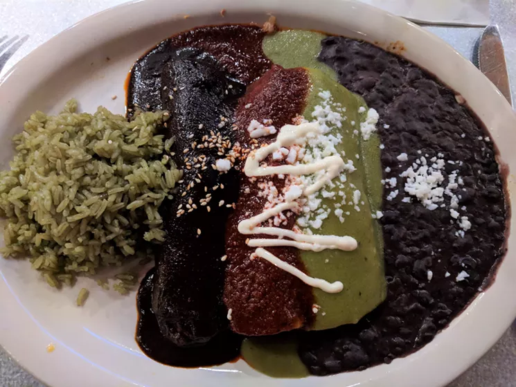 Charley's Choice is a combo of three styles of enchilada. From left: chicken mole, brisket in guajillo salsa and shrimp in poblano crema. - BRIAN REINHART