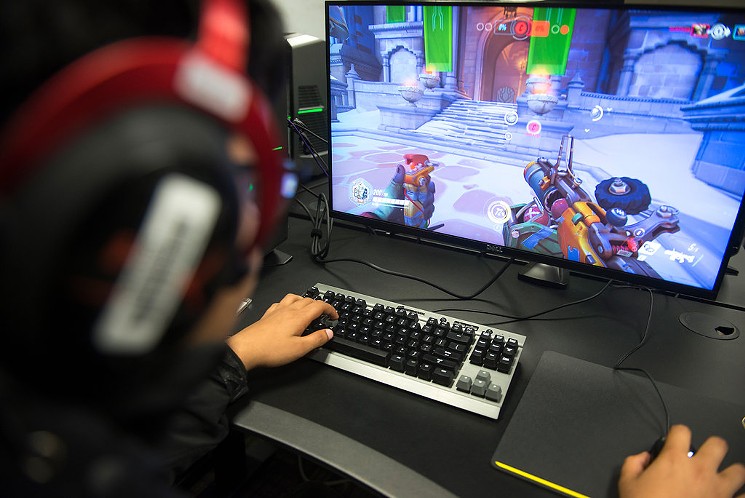 Students play eSports at The Nest, a space for competitive gaming in University of North Texas' media library. - BRIAN MASCHINO