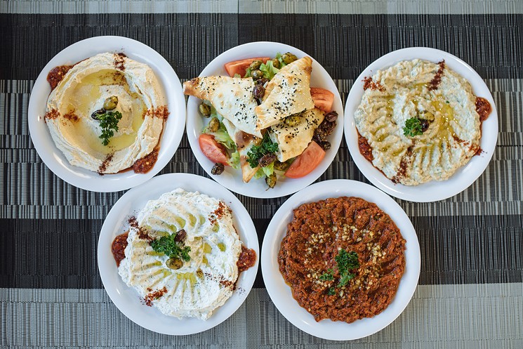 Meze: (clockwise from left) hummus, tantuni pies, baba ghanoush, ezme, haydari - KATHY TRAN