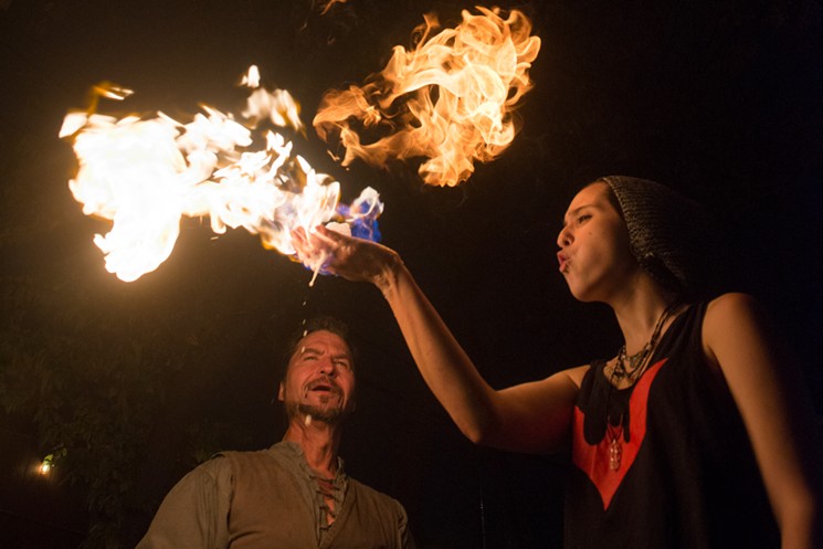 Thomas watches one of his students manipulate the flame at the Green Elephant. - BRIAN MASCHINO