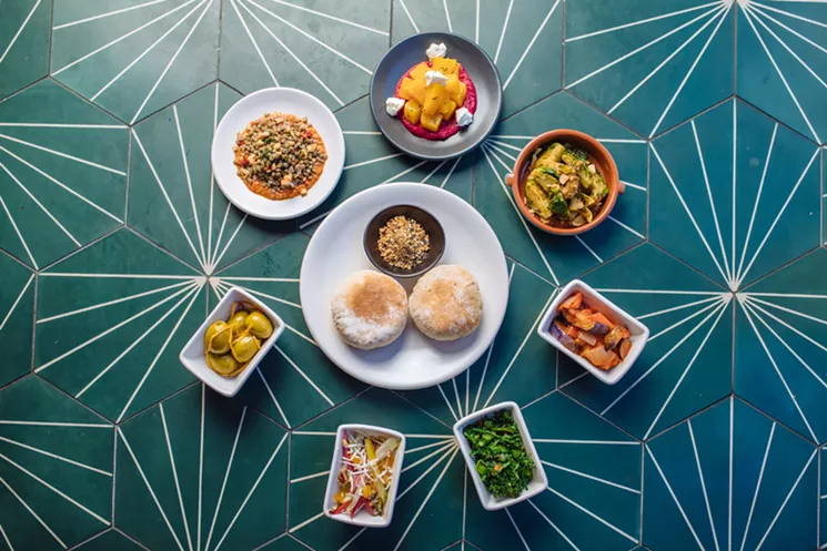 Sachet's meze menu is populated by small, light vegetable dishes like the popular yellow beets with red beet hummus (top center). - KATHY TRAN