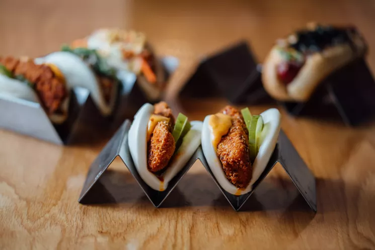 Dill pickles, the ones that like to sit in your fridge for months, surround the chicken under molten American cheese. One bite in and it's obvious that chef Dien Nguyen has got something here. - KATHY TRAN