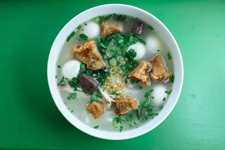Sapp Sapp’s kowpiak “Xay-style" is a massive bowl of soup brimming with beef, crispy pork belly, cubes of pork blood, quail eggs and herbs. - KATHY TRAN