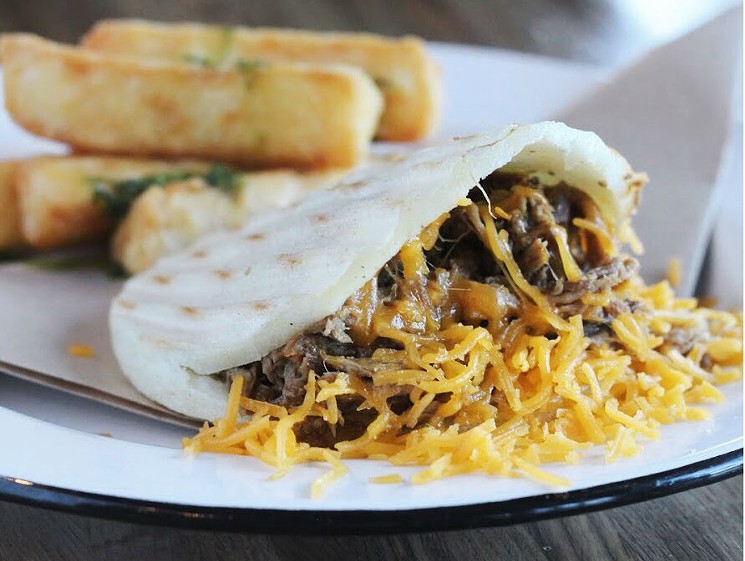 The Carne Mechada arepa ($7.50) is a stunner with slow-cooked, shredded beef and spiked with soffit and shredded cheese. - AREPA TX