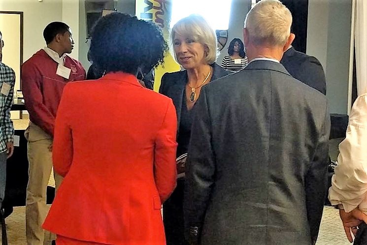 U.S. Education Secretary Betsy DeVos and somebody else who looks familiar from the back. - STEPHEN YOUNG