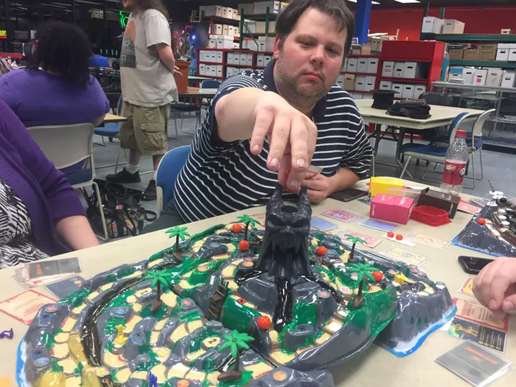 Scott Sumner prepares to unleash a fury of fireballs through Vul-Kar's head during a recent demo of Restoration Games' new sequel to Fireball Island. - DANNY GALLAGHER