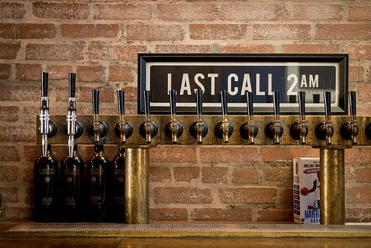 The Parlor's style was the modern dive bar at its best — simple but thoughtful, with vintage pinball and a bar top repurposed from old gymnasium flooring. - ALISON MCLEAN