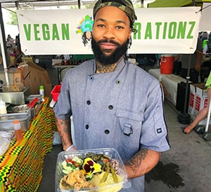 Jovan Cole, owner of Vegan Vibrationz, a popular food stand (and catering business) at Dallas Farmers Market. - DALILA THOMAS