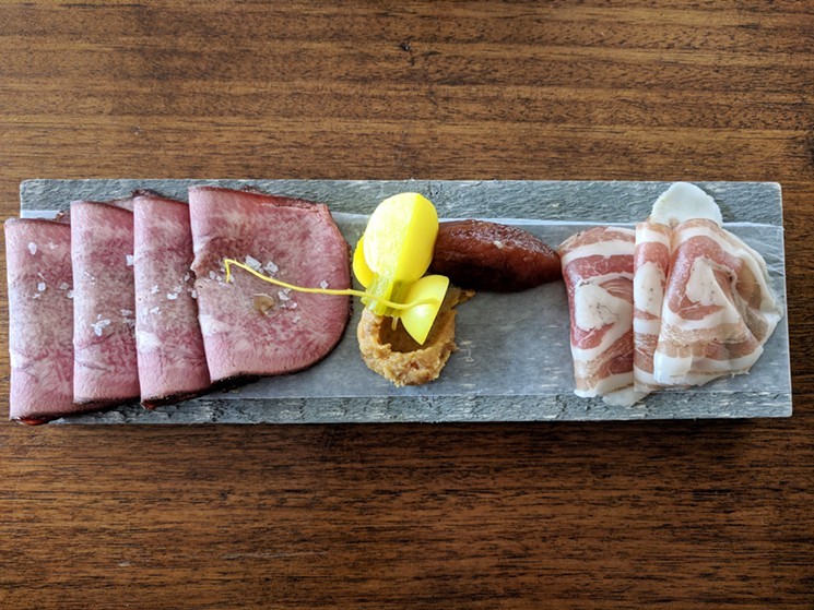 Smoked beef tongue and spalla (rolled and cured pork shoulder) with pickled turnips, spicy mustard and a chunky apple butter suffused with winter spices. - BRIAN REINHART