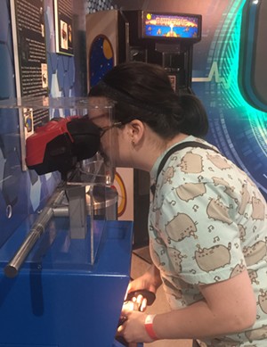 Ashley Wolff of Plano plays Virtual Boy Wario Land on Nintendo's Virtual Boy console at the National Videogame Museum in Frisco in their new exhibit on virtual reality technology. - DANNY GALLAGHER