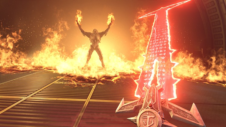 The Doom Slayer unsheaths a massive energy sword for a boss fight in the upcoming first-person shooter DOOM Eternal. - COURTESY BETHESDA