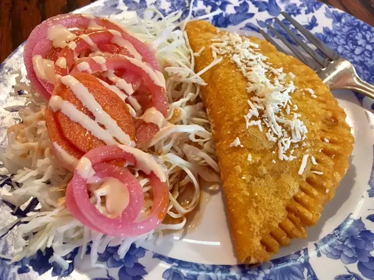 The pastelito Hondureño, a deep-fried annatto and corn tortilla stuffed with house-ground beef - AMANDA ALBEE