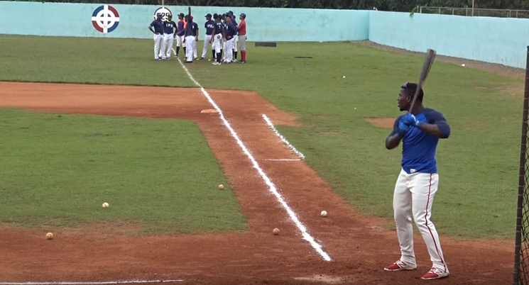Juan Pablo Martinez works out for scouts in the Dominican Republic in 2017. - ALEX MARIN VIA YOUTUBE