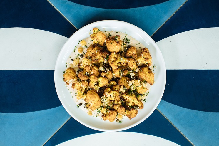 Zaytinya is known for its elegant Mediterranean vegetable dishes, like this roasted cauliflower with tahini and sultanas. - KATHY TRAN