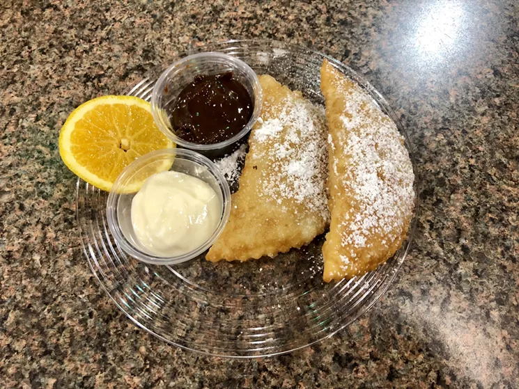 The Orange You Glad We Fried It?, an empanada-like pastry filled with chiffon orange cake, whipped cream and orange preserves. - PAIGE WEAVER
