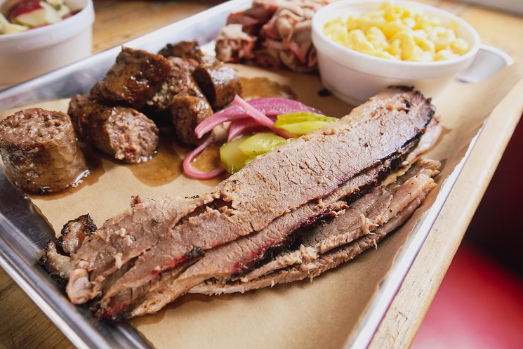 Louie King serves up delicious Akaushi brisket. We've got gripes about how it's sliced, but no such complaints about its flavor. - CHRIS WOLFGANG
