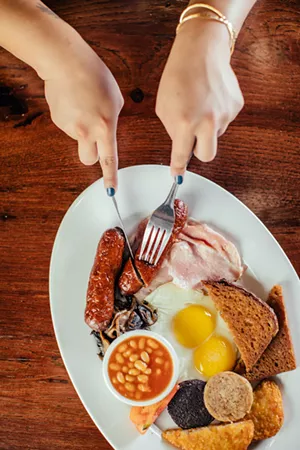 The Playwright's pub fare includes fish and chips, Scotch eggs and a traditional Irish breakfast (pictured). - COURTESY KATHY TRAN