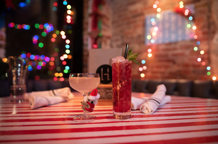 Hide's Christmas cocktails are served in custom Miracle glassware that you can buy at the bar. - COURTESY HIDE