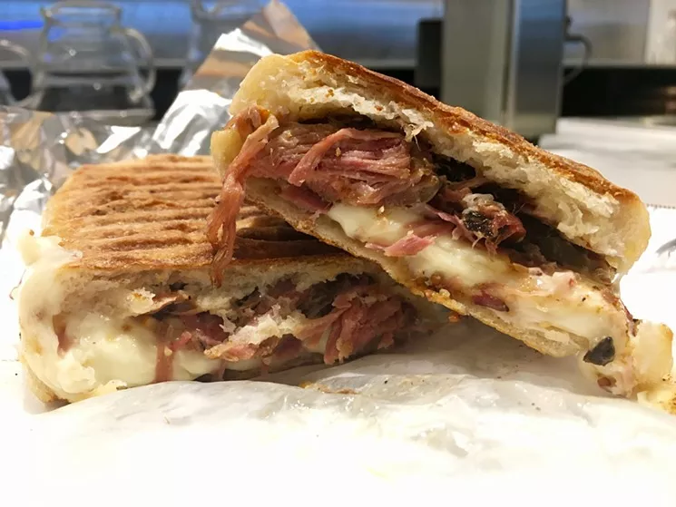 A Texas spin on the Cuban, with Pecan Lodge pork, Tasso ham, Muenster, house pickles, whole grain mustard at Civil Pour ($11). - NICK RALLO