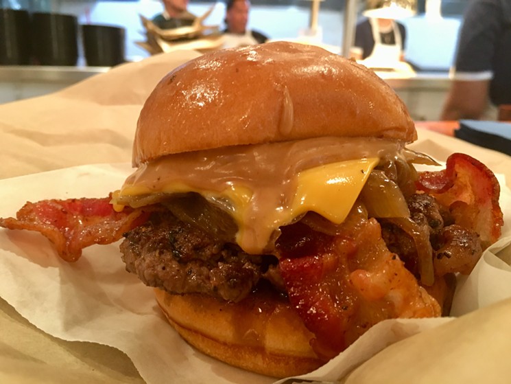 The peanut butter and bacon burger: A quarter-pound of Nebraska chuck beef topped with Jif, the creamy stuff, with hot pepper jam on a soft brioche bun for $6.59. - NICK RALLO