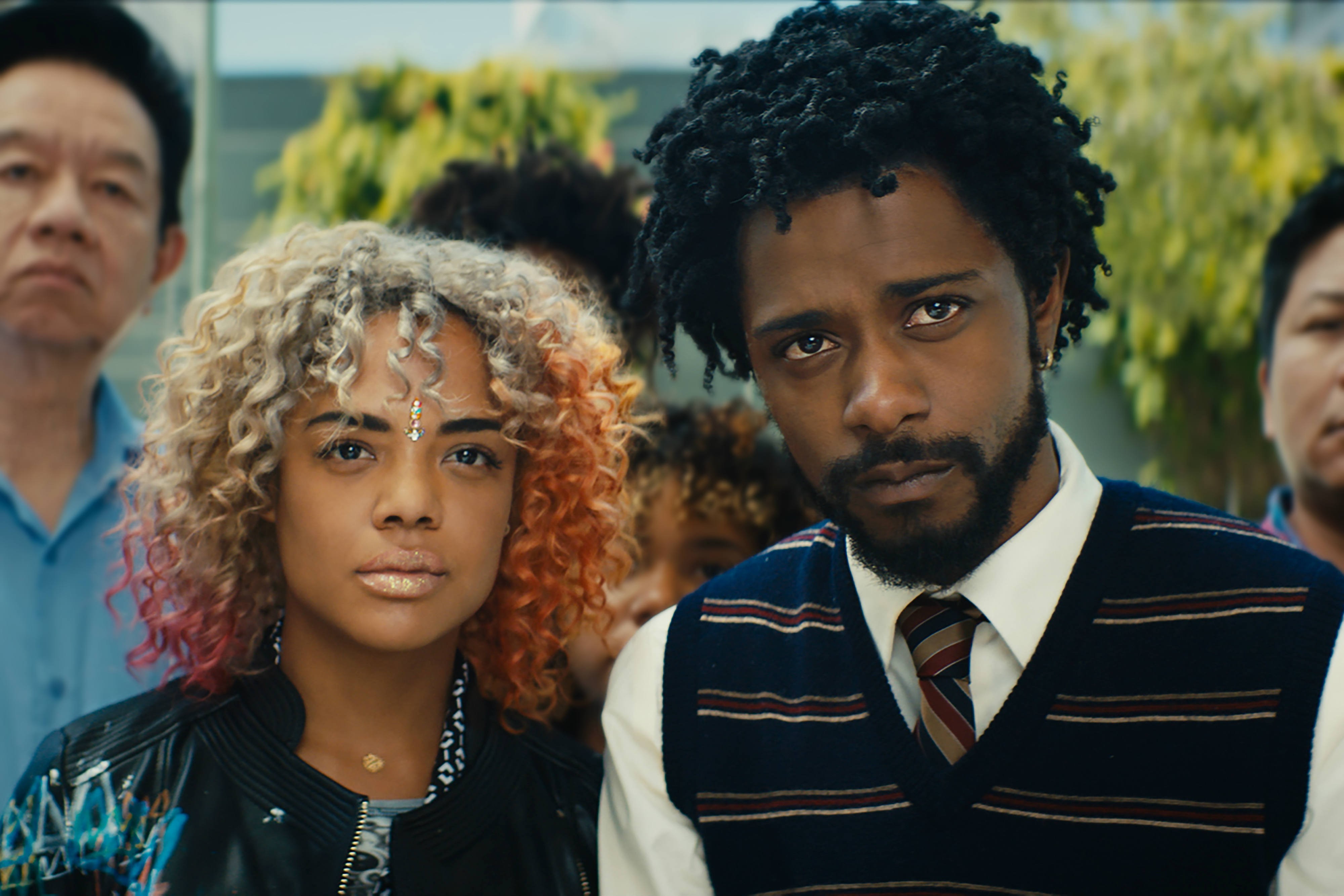 Tessa Thompson (left) and Lakeith Stanfield are two of the stars of Sorry to Bother You, a satire about a guy who takes a telemarketing gig and finds that affecting the voice of a white man is the key to success. - COURTESY OF ANNAPURNA