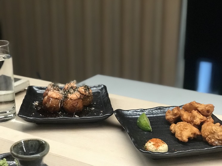 Izakaya appetizers are a nice way to start the meal. Pictured here: takoyaki, aka octopus dumplings (left), and chicken karaage (Japanese fried chicken). - BETH RANKIN