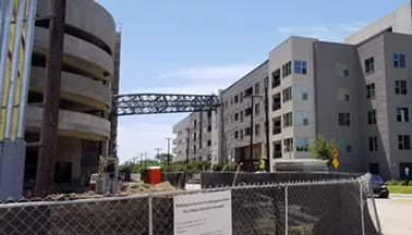 Sunday's crane accident at Elan City Lights apartments also caused extensive damage to the parking garage and many of the residents' vehicles. The five-story complex has been vacated indefinitely for repairs. - SILAS ALLEN