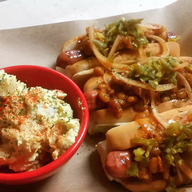 The Snoop Dogg Pack: Each dog is topped with bacon, baked beans, pickled jalapeño, pickled onion and maple syrup drizzle for $13.99. - NICK RALLO