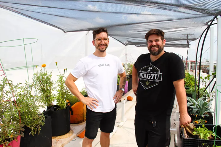 Yoni Lang (left) and Joel Orsini were the two-man show in the kitchen of Izkina. They were also behind the life sprouting atop the hostel's Deep Ellum roof. - TAYLOR ADAMS