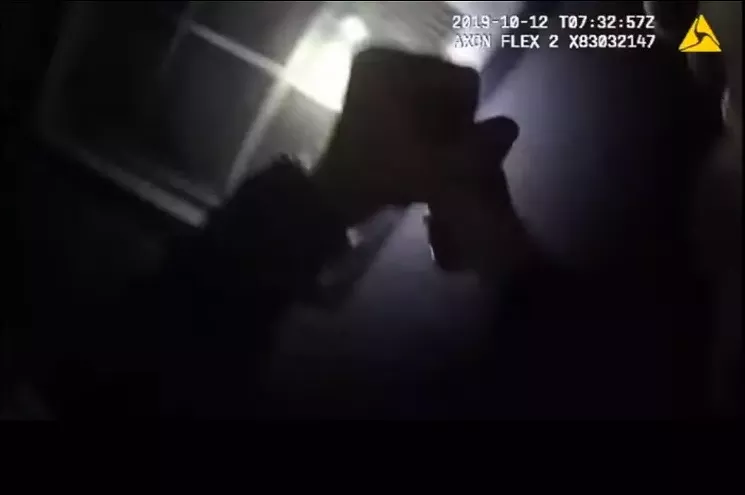 Fort Worth police officer Aaron Dean raises his gun to shoot Atatiana Jefferson. - FORT WORTH POLICE DEPARTMENT
