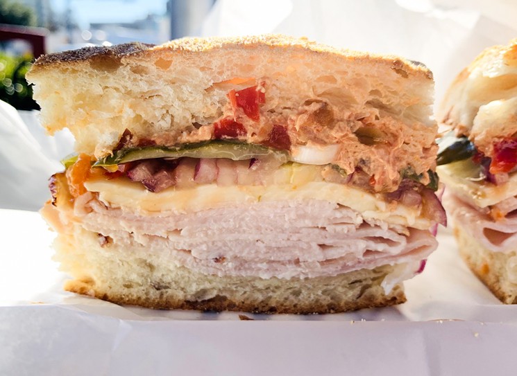 Peppered turkey, pickles, onions, two slices of pepper jack cheese on house-baked "bone bread" at Eatzi's on Oak Lawn for less than nine bucks. - NICK RALLO