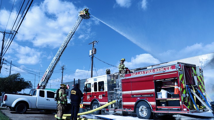Firefighters aim a jet of water at the building's roof, which collapsed during the blaze. - KURTZ FRAUSUN, OWNER OF  STUDIO | FRAUSUN: WWW.KURTZFRAUSUN.COM
