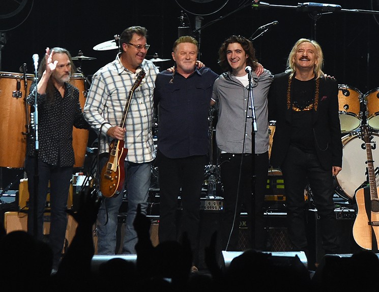 The Eagles, riding on a dark desert highway, cool wind in their hair, will be in Dallas to play their most famous hits. - RICK DIAMOND / GETTY IMAGES