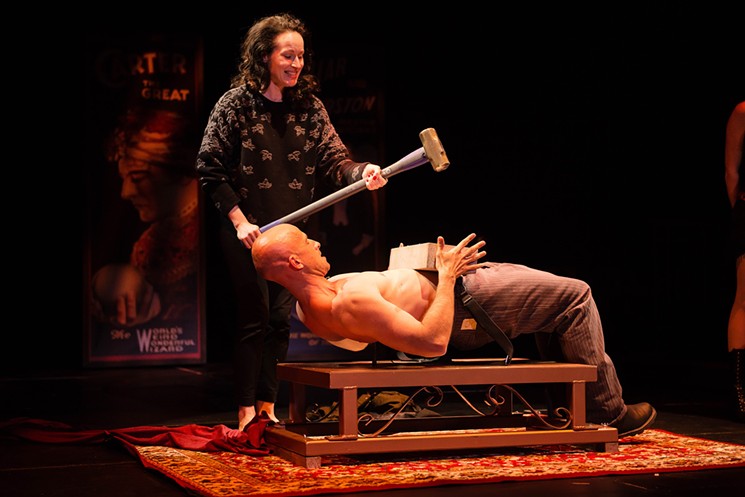 Jonathan Goodwin takes one to the belly while lying on a bed of nails in The Illusionists. - COURTESY THE ILLUSIONISTS