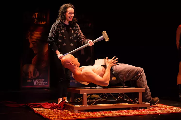 Jonathan Goodwin takes one to the belly while lying on a bed of nails in The Illusionists. - COURTESY THE ILLUSIONISTS