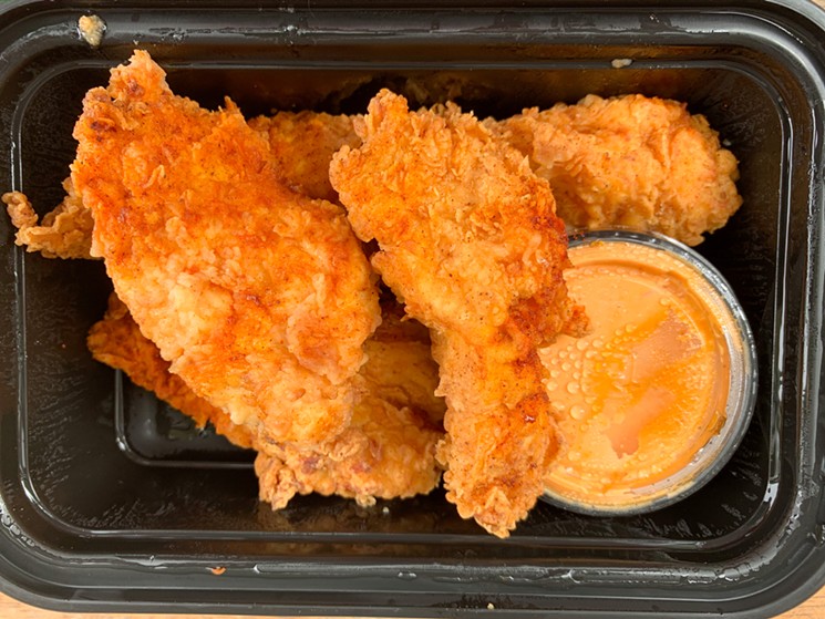 Chicken strips are made with chicken breast and get a buttermilk bath and battered before deep frying. That cup on the side is a guajillo ranch. - TAYLOR ADAMS