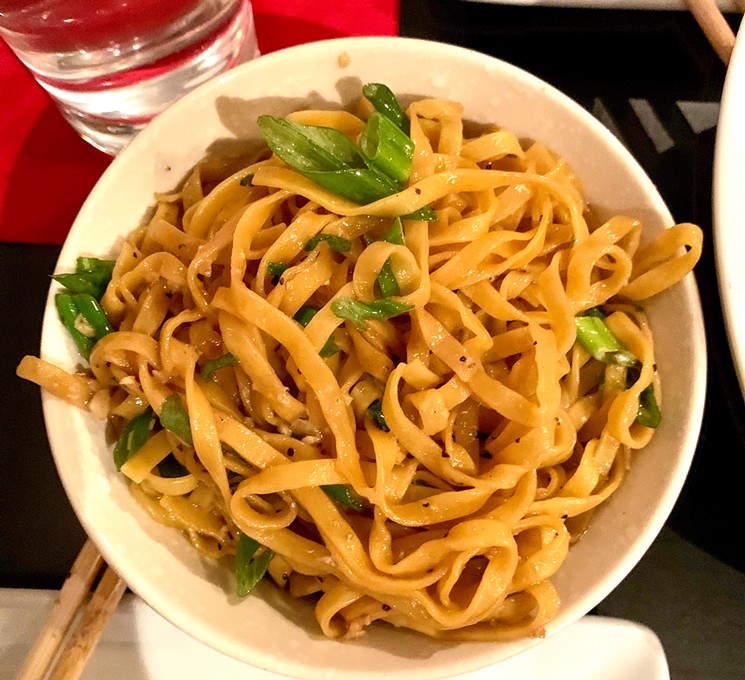 Garlic noodles from Mot Hai Ba, which pair easily with a protein cooked at home. - TAYLOR ADAMS