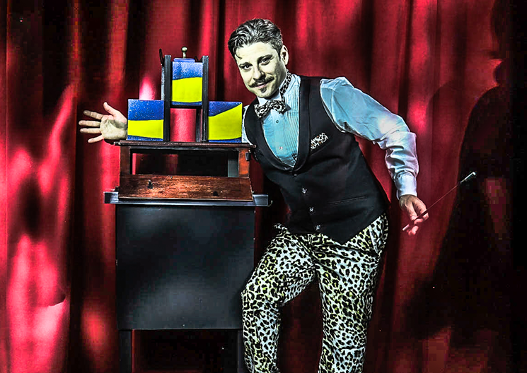 Edward Ruiz, also known as Deep Ellum's most famous magician Confetti Eddie, performing an illusion at his magic parlor on Exposition Avenue. - DANY HOLLENBECK
