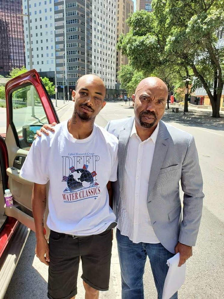 Saenz and his attorney Daryl Washington after Saenz was discharged from the hospital: Washington says they want more than a civil settlement from the city. They want the officer who shot him and those who didn't help Saenz as he bled on the sidewalk to face criminal charges. - COURTESY DARYL WASHINGTON