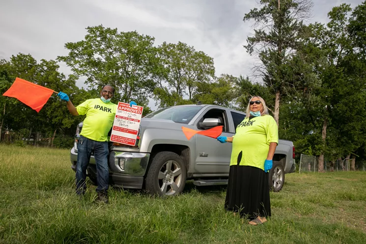 Mike Davis and his wife, Gaytha, in their lot across from Fair Park that they have used for fundraising in past fair years. - NATHAN HUNSINGER