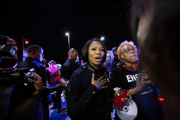 Local activist Pamela Grayson stands next to Dallas Police Chief U. Reneé Hall trying to calm the crowd of protesters before C.S. gas was deployed on May 29. - MELISSA HENNINGS