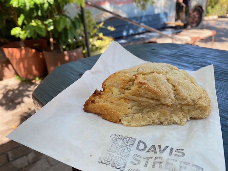 A lemon and goat cheese scone in the courtyard at Davis Street Espresso. - LAUREN DREWES DANIELS