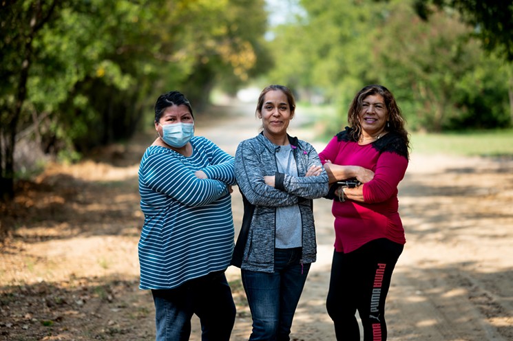 These Green Tree residents worked to bring clean water to their community. From left to right: Beatrice, Elva, Gladis. - MIKE BROOKS