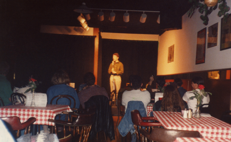 Comedian and Four Day Weekend co-founder David Ahearn performs a set in the early 1990s at the Backdoor Comedy Club. - LINDA STOGNER
