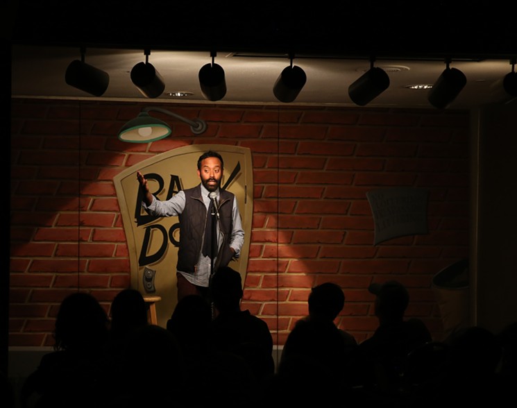 Dallas native and national touring comedian Paul Varghese performs a set in 2018 at the Backdoor Comedy Club's Doubletree Hotel location. - LINDA STOGNER