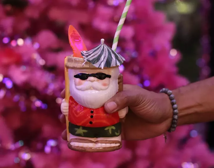 Pink trees, beach balls and tiki drinks make for the most tubular holiday pop-up at Sippin' Santa. - SUSIE OSZUSTOWICZ