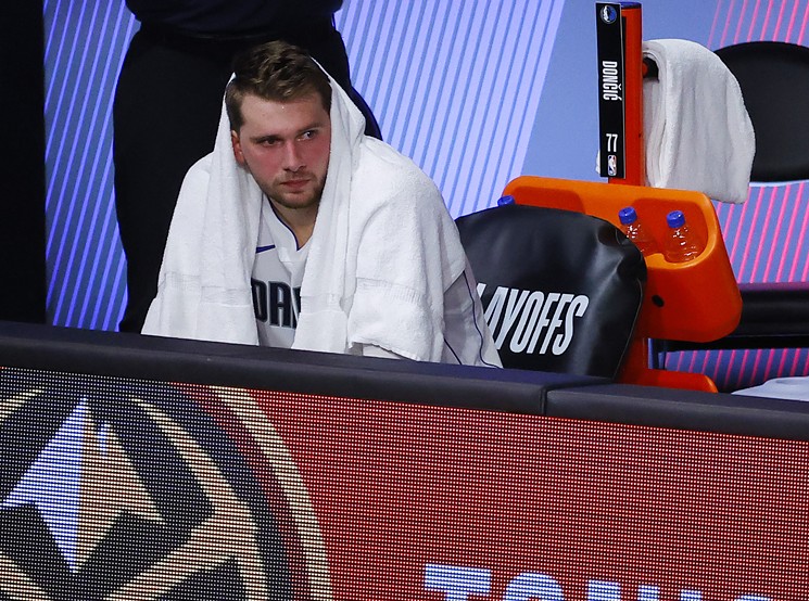 Luka Doncic #77 of the Mavericks was benched with  a sprained ankle in 2020. - KEVIN C. COX/GETTY IMAGES