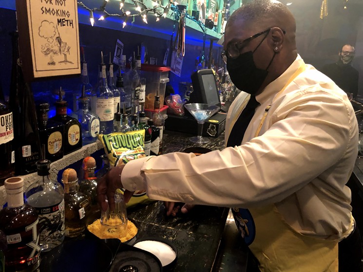 Bartender Michael Casteel coats a glass with ground Funyuns for The Whippersnapper new signature Breaking Bad drink called Captain Cook, a vodka cocktail infused with Jesse Pinkman's favorite bagged snack. - DANNY GALLAGHER