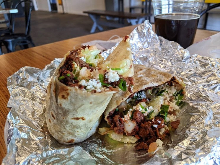 Tacos La Gloria's burrito is a minimalist affair with just meat, cheese, lettuce and cilantro. - BRIAN REINHART