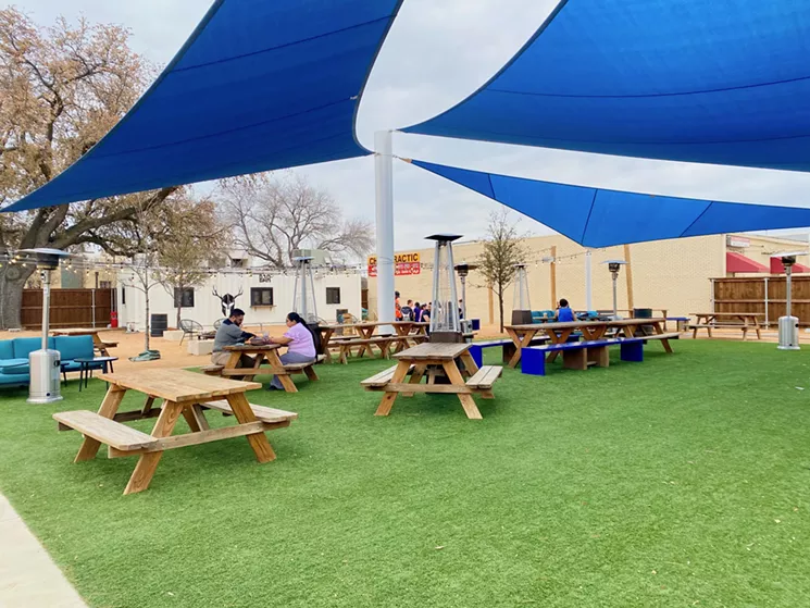 The courtyard at FireHouse Gastro Pub. The stage is off camera to the right and in the far back is cornhole. - LAUREN DREWES DANIELS